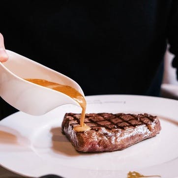 Set of Steak Knives with Apron and Three Course Dining Experience and Cocktail for Two at Marco Pierre White's London Steakhouse Co