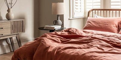 piglet in bed orange sheets