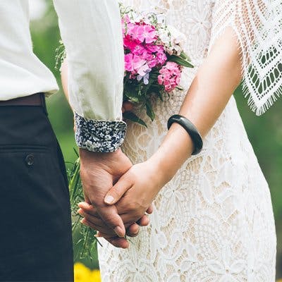 wedding couple holding hands registry